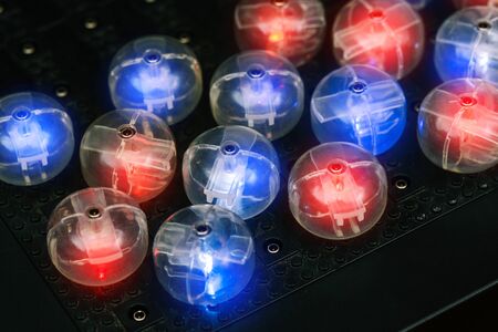 Colored luminous bulbs. Abstract lights background. Glowing light bulb design. Concept for...