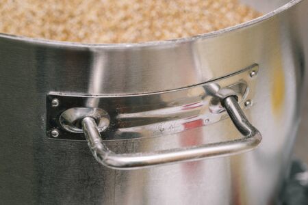 Large stainless steel pan for cooking food and drinks. Open tank with ingredientsの写真素材