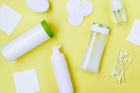 Packaging for cosmetics without labels on a yellow background. Cosmetic products backgroundの写真素材