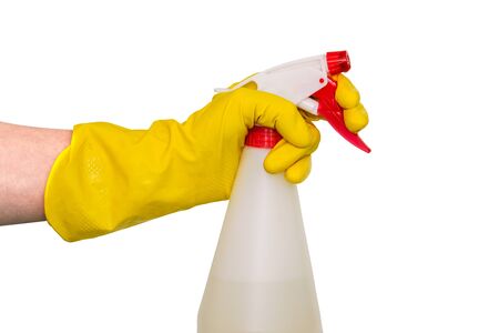 Sprayer for cleaning and disinfection of office and home. A hand in a yellow glove holds a spray with a dispenser. Spray bottle isolated on a white background.の写真素材