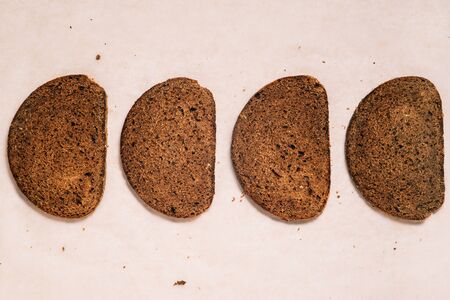 Four slices of bread on paper. Sliced delicious breadの写真素材