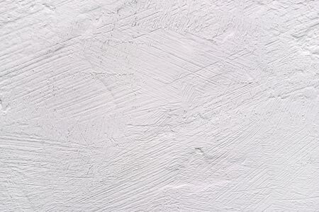White background with a textured surface. Plastered wall or table.の写真素材