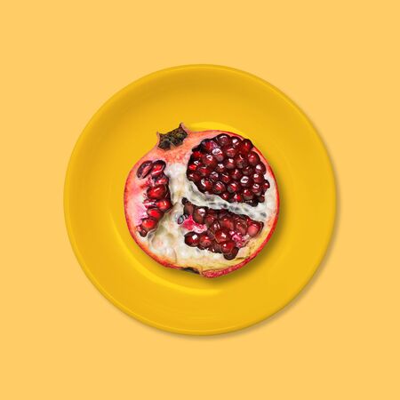 Red garnet in an orange plate. Summer style. Minimal design Art.の写真素材