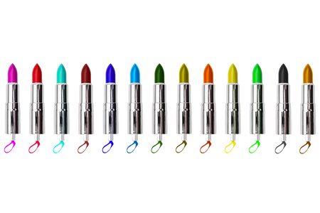 Set of colored lipsticks isolated on a white background. Open tubes of lipstick in silver packaging. Glossy women's lipstick. Makeup tools. Cosmetic product.の写真素材