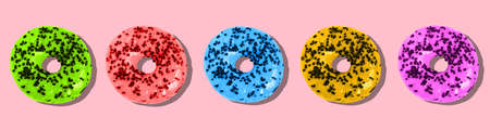 Colored donuts on a pink background. Sweet doughnut with icingの写真素材