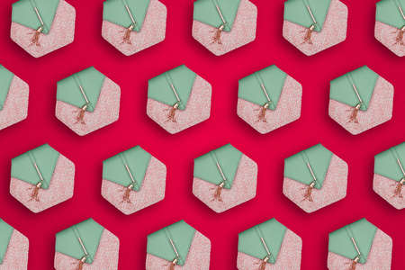 Fashionable womens purse on a red background. Womens accessories repeat. The minimum concept of fashion.の写真素材