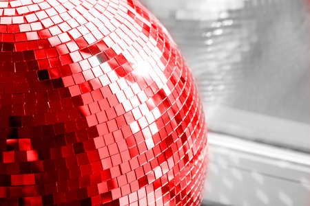 Red Disco ball. Mirror ball. Concept of a night club party, club life.の写真素材