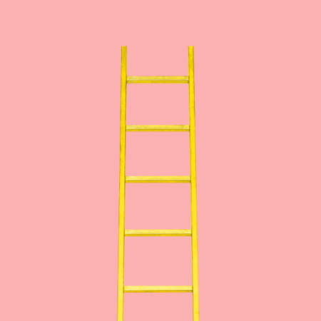 Yellow staircase on a pink background. Minimum concept idea of the concept. The concept of the career ladder. The progress of the recovery.の写真素材