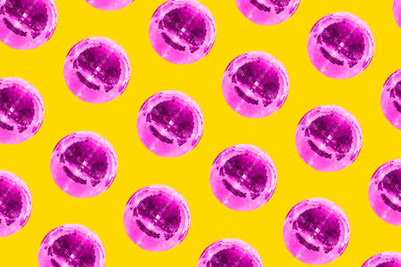 Disco ball pattern on a yellow background. Bright creative colors. Concept of music, holiday and...