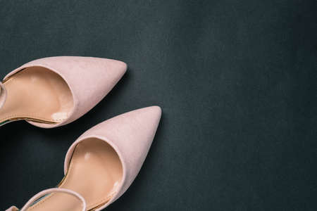 Womens shoes on a dark background with a copy of the space. Stylish shoes close-up. Womens blog. Sale and delivery of goodsの写真素材