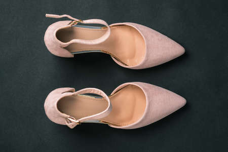 Womens shoes isolated on a black background. Womens fashion and style. Sale and delivery of shoes. Flat layout, top viewの写真素材