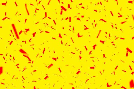 Red confetti on a yellow background. Bright holiday backgroundの写真素材