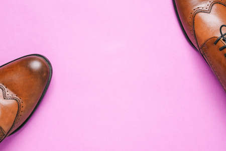 Mens shoes on a purple background with a copy of the space. Sale of shoes and delivery of goods from...