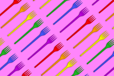 Multicolored plastic forks on a pink background. Creative minimal styleの写真素材