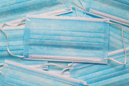 Disposable medical mask in blue. Background and medical masks. Medicine and healthcare.の写真素材