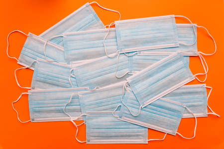 Medical masks on a colored background. Surgical blue mask. Medicine backgroundの写真素材