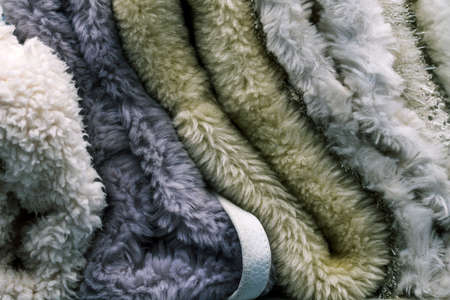 Wool fabric. A soft and warm blanket. Material for the production of clothing. Cloth samples close up. Textile background.の写真素材
