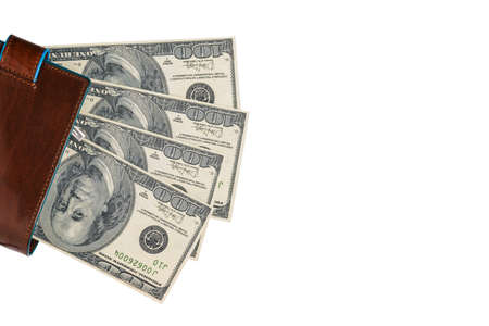 Male wallet with dollars isolated on a white background. Cash close up with copy space. Hundred...