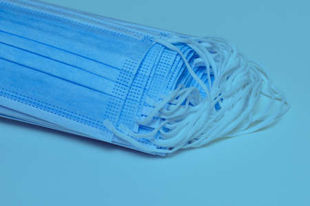 Protection against inhalation of viruses and bacteria. Disposable medical mask with earloopsの写真素材