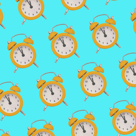 Yellow alarm clock on a colored background. Creative pattern with a clock. Minimal trendy styleの写真素材