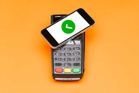 Mobile phone payment approval process. Contactless payment for purchases using a smartphone. Top...