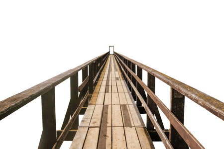 Old wooden bridge isolated on a white background. A pathway pedestrian bridge extending into the horizonの写真素材
