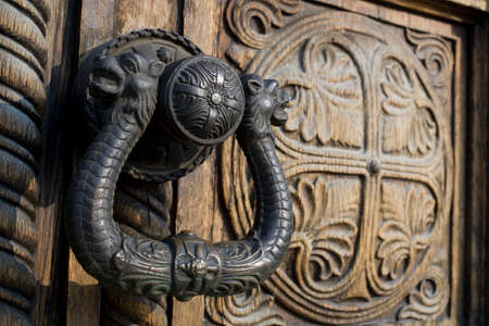 Ornate wooden doors and door hardware of an eastern orthodox church Aleksandar Nevski in Sofia, Bulgariaの写真素材