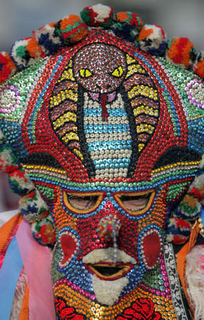 A man with traditional Kukeri mask 