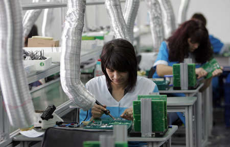 BOTEVGRAD, BULGARIA - FEBRUARY 25  Workers assembling electronics in diode factory, Feb 25, 2011,...