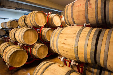 Wine barrels stacked in the old cellar of the winery, Bulgaria.のeditorial素材