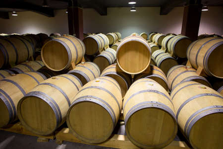 Wine barrels stacked in the old cellar of the winery, Bulgaria.のeditorial素材