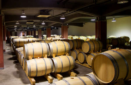 Wine barrels stacked in the old cellar of the winery, Bulgaria.のeditorial素材