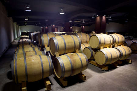 Wine barrels stacked in the old cellar of the winery, Bulgaria.のeditorial素材