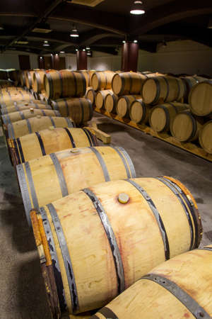 Wine barrels stacked in the old cellar of the winery, Bulgaria.のeditorial素材
