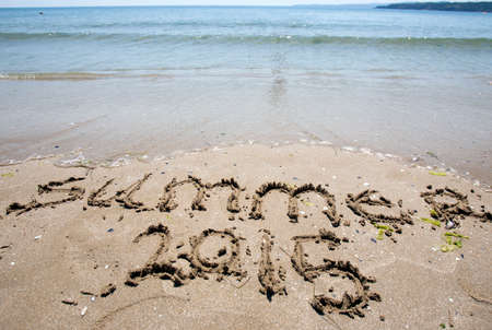 New year 2015 written in sand.の写真素材
