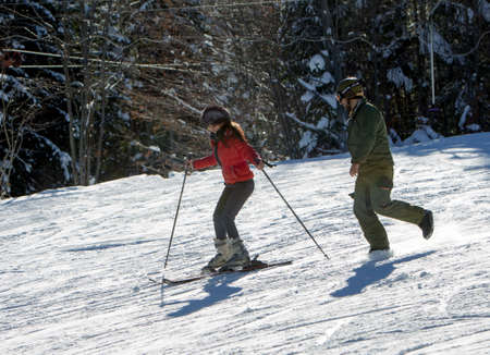 SOFIA, DOBRINISHTE - JANUARY 1: Tourists are enjoy the sunny weather and skiing on January 1, 2015 in Dobrinishte.のeditorial素材