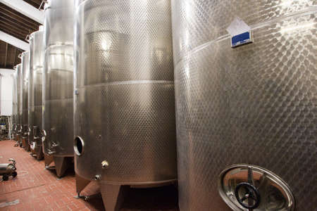 Modern aluminum barrels for wine in wine factory