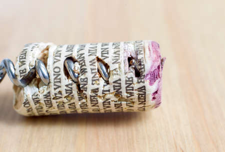 Used cork wine cap on light brown background.の写真素材