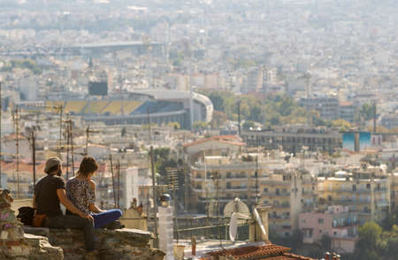General view of Thessaloniki town from Trigonon tower and a couple.の写真素材