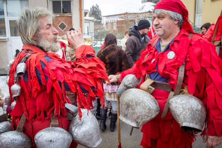 BREZNIK, BULGARIA - JANUARY 21, 2017: Masquerade players called "Kukeri" are seen during customary games on January 21, 2017 in Breznik, Bulgaria.のeditorial素材