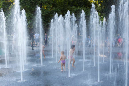 PLOVDIV, BULGARIA - JULY 30: Kids are playing in fountains in central park in Plovdiv, on July 30, 2017, Bulgaria.のeditorial素材