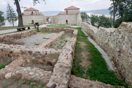 BELCHIN, BULGARIA - SEPTEMBER 3, 2016: Tourists walks arround partly reconstructed roman fortress Cari Mali Grad, near town of Belchin, 3 September, 2016, Bulgaria.のeditorial素材