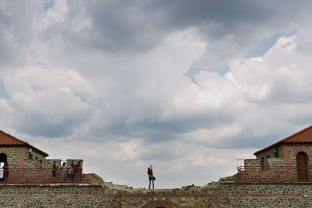 BELCHIN, BULGARIA - SEPTEMBER 3, 2016: Tourists walks arround partly reconstructed roman fortress Cari Mali Grad, near town of Belchin, 3 September, 2016, Bulgaria.のeditorial素材