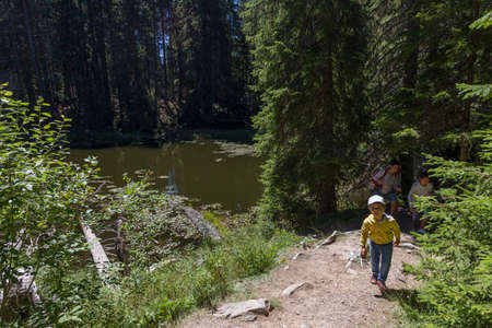 RHODOPE, BULGARIA - AUGUST 1: Tourists cross along Rhodopes mountain, area of Smolyan lakes, on August 1, 2017, Bulgaria.のeditorial素材