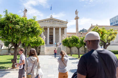 ATHENS, GREECE - 1 MAY 2019: People look around the building of Academy of Athens in Athens, Greece.のeditorial素材