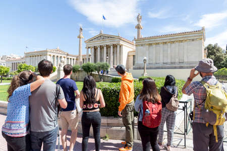 ATHENS, GREECE - 1 MAY 2019: People look around the building of Academy of Athens in Athens, Greece.のeditorial素材