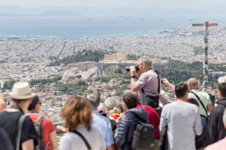 GREECE, ATHENS - 1 MAY: Tourists are enjoying a view of Athens city, Greece from Mount Lycabettus, 1 May, 2019.のeditorial素材