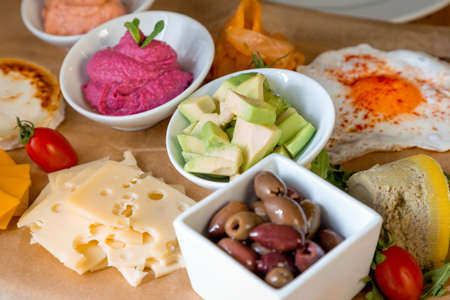 Restaurant table with variety of foods and beverages.の写真素材