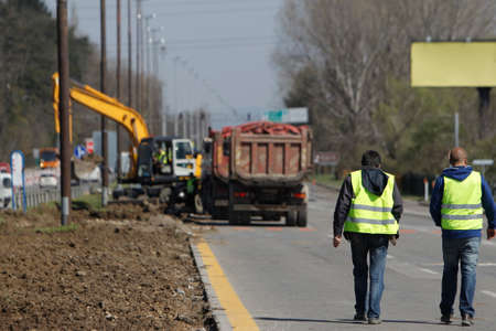 Sofia, Bulgaria - Motorway maintenance men working at the side.の写真素材