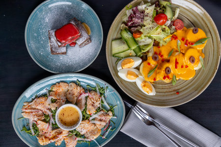 Variety of meals arranged on a dining table.の写真素材